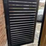 black aluminum semi privacy fence door